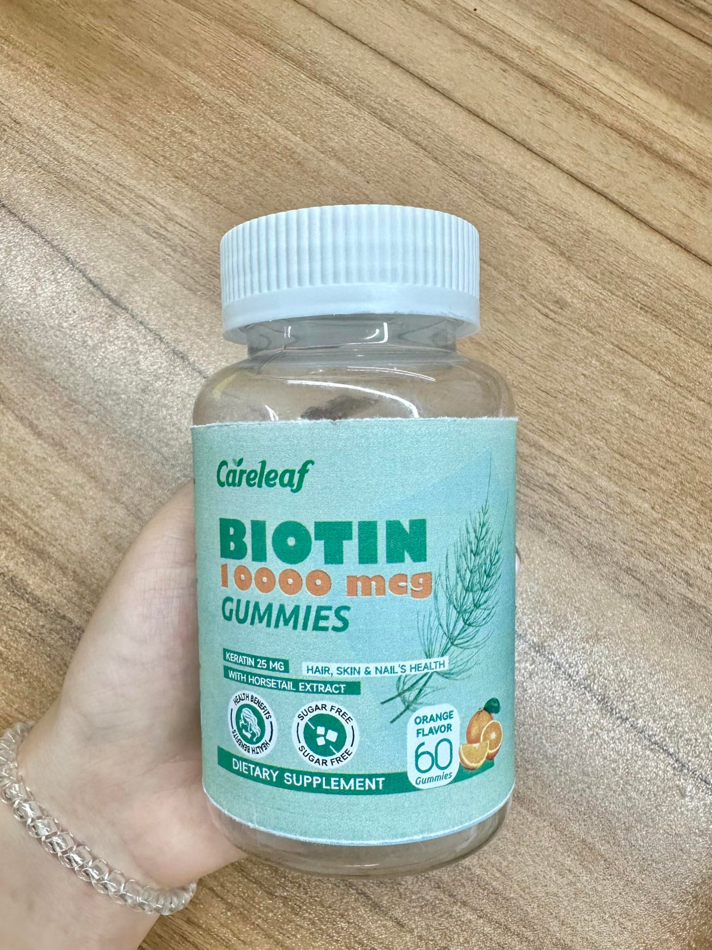 Botella de gomitas biotina careleaf para cabello uñas piel sabor naranja