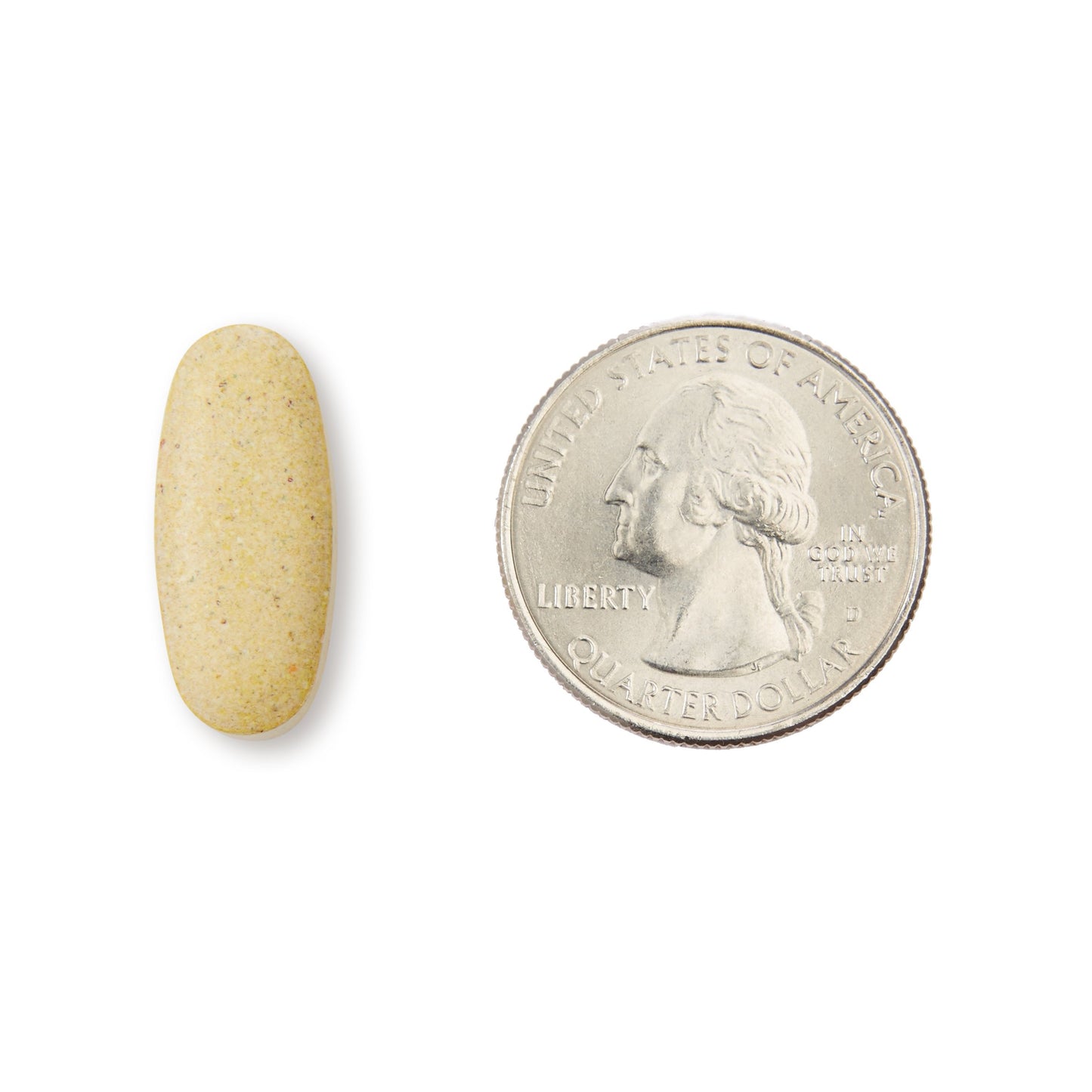 Tamaño de comprimido de multivitaminas junto a moneda