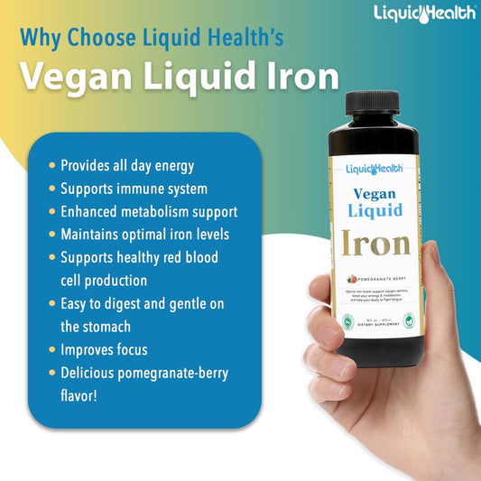 Botella grande de hierro líquido vegano Liquid Health en fondo de mano