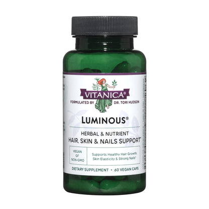 botella verde de luminarias vitaminas veganas