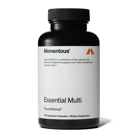 Botella de multivitaminas Momentous Essential para hombres y mujeres.
