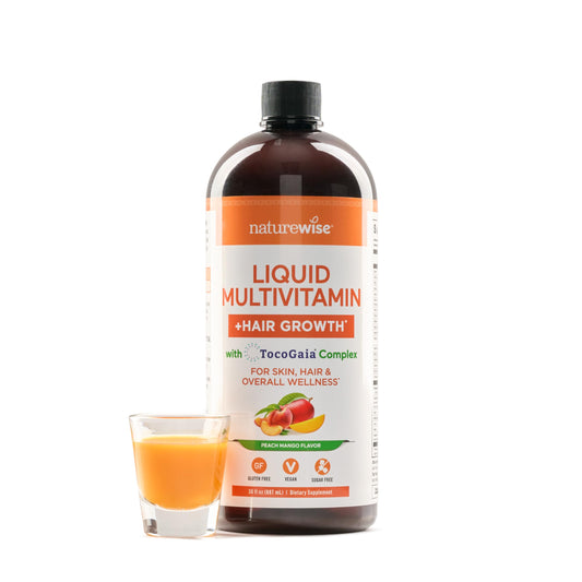 Botella de multivitaminas líquidas NatureWise con sabor mango melocotón para el crecimiento del cabello.