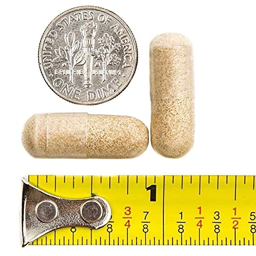 cápsula multivitamínico bariatricpal al lado de una moneda para referencia