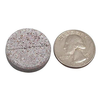 Comprimido de las multivitaminas BariatricPal junto a moneda