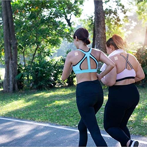 Dos mujeres corriendo con parche Multi Plus en el brazo