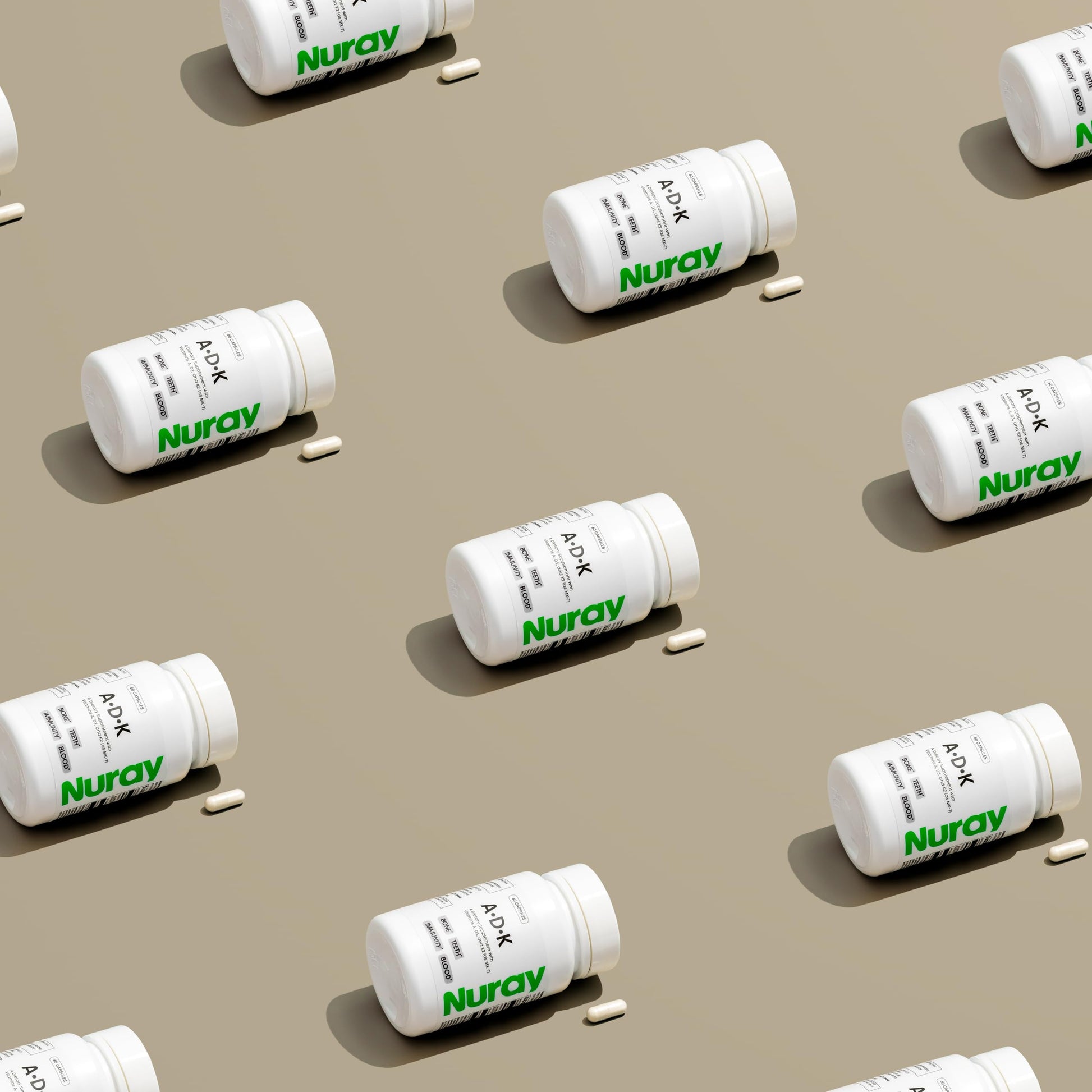 Frente paquete suplemento Nuray ADK con vitaminas esenciales