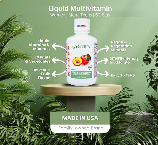 Go Healthy multivitamina líquida sobre un pedestal rodeado de plantas