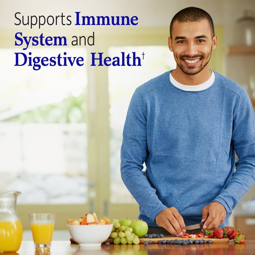 Hombre con frutas frescas enfatizando salud digestiva e inmunológica