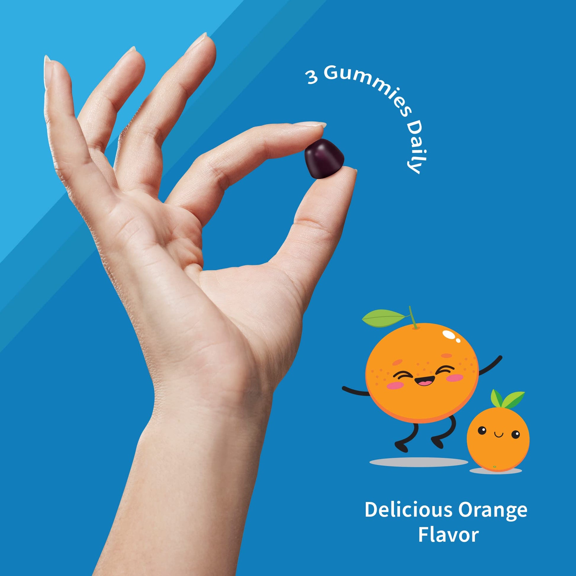 Mano sosteniendo una gomita multivitamínica Garden of Life para niños.