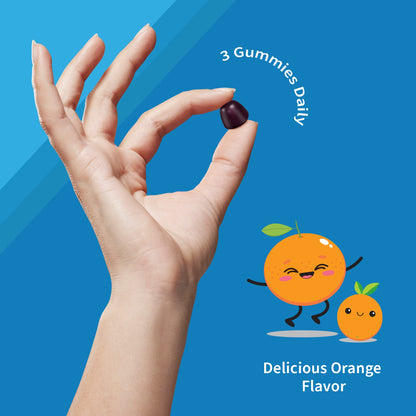 Mano sosteniendo una gomita multivitamínica Garden of Life para niños.