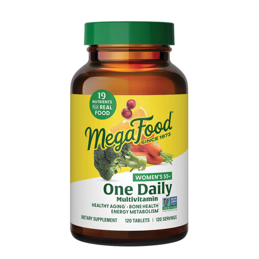 Frasco de MegaFood Women's 55+ multivitaminas con tapa verde.