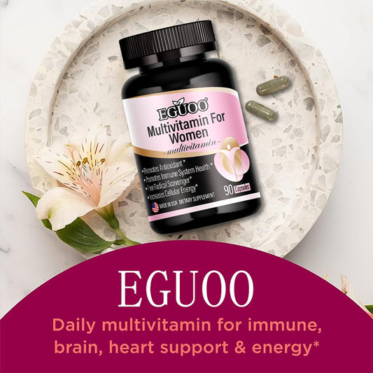 Multivitaminas EGUOO en mesa con flor
