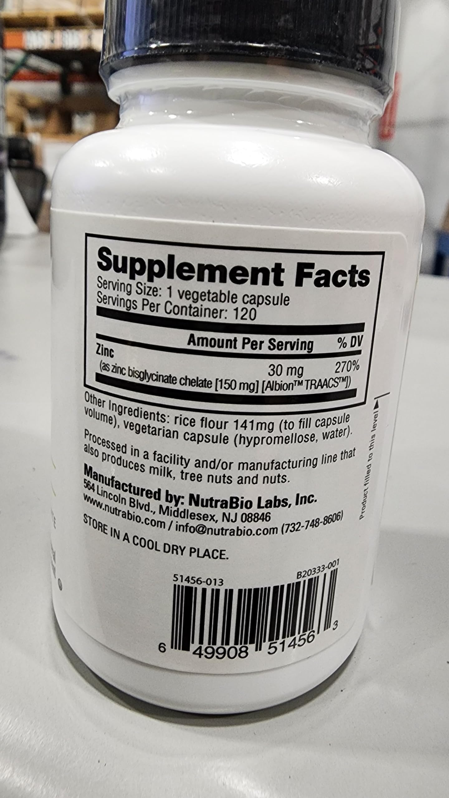 Suplementos NutraBio vitamina B-100 y magnesio en cápsulas