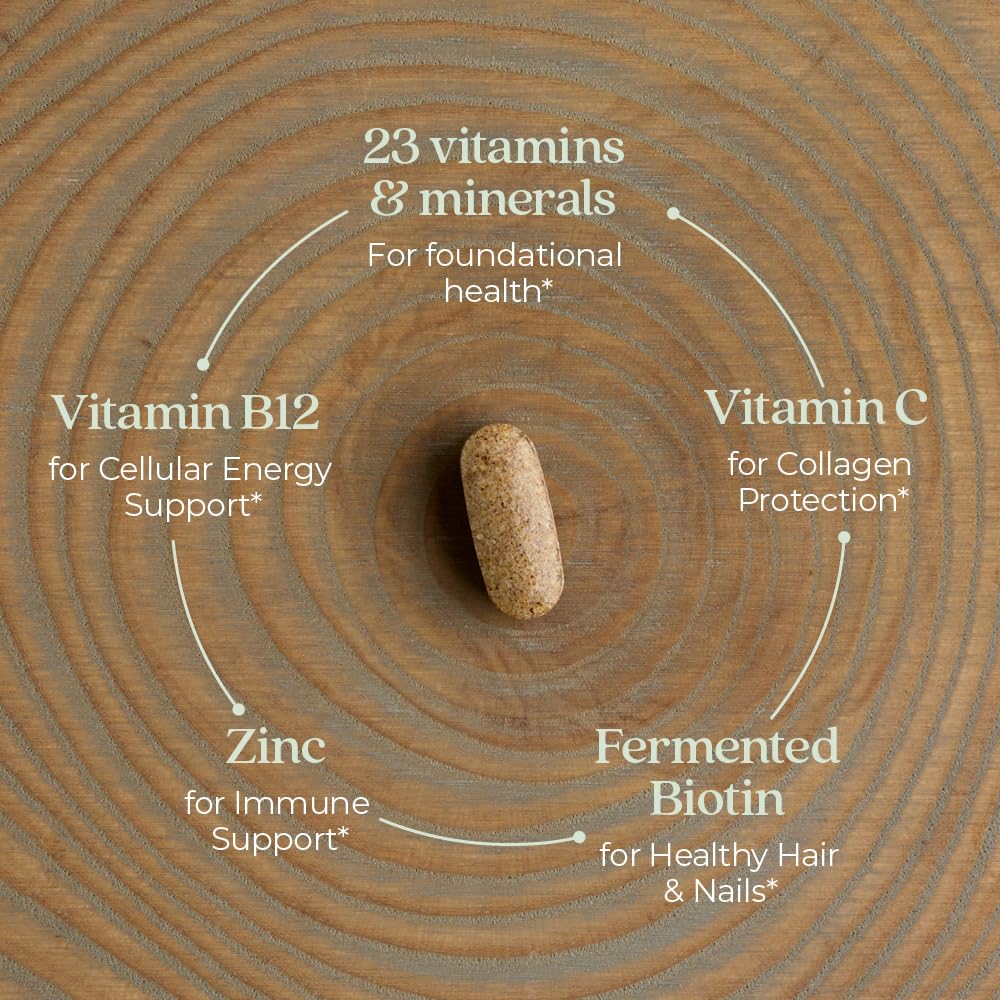 Tableta de multivitamina en madera con vitaminas y minerales