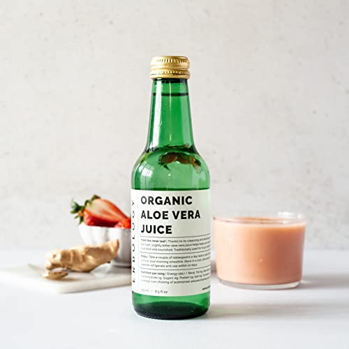 Botella de vidrio reciclable con jugo natural de aloe vera