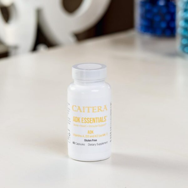 Frasco y etiqueta del suplemento Caitera ADK Essentials