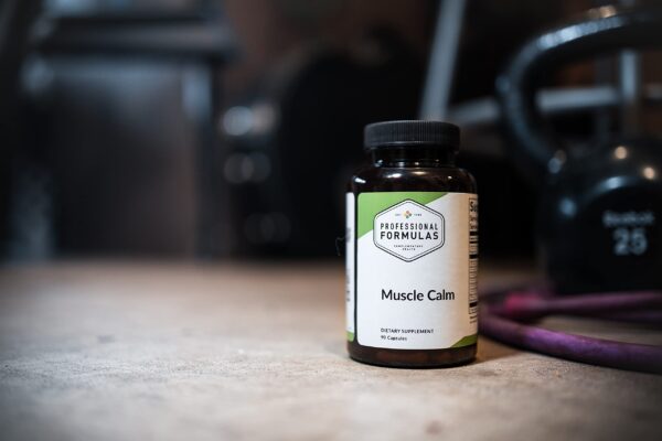 Caja y frasco Professional Formulas Muscle Calm suplemento movilidad