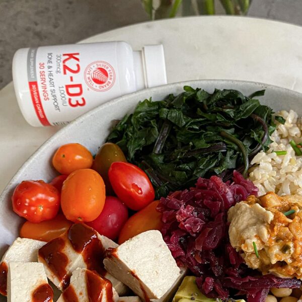 Cápsulas K2-D3 en frasco transparente