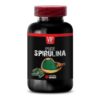 Frasco cápsulas de spirulina natural suplemento saludable