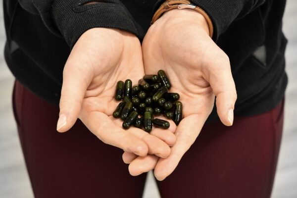 Frasco y cápsulas CoQ10 Swolverine