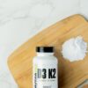 Frasco cápsulas NutraBio Vitamina D3 + K2 alta potencia