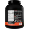 Cucharón medidor dentro del envase R1 Whey Isolate