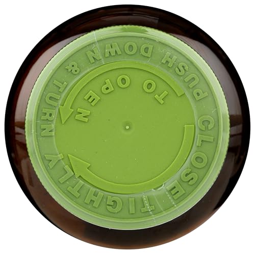 Mesa con frasco y tabletas Nutrex Hawaii Spirulina pura