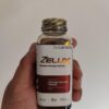 Suplemento Zelux cápsulas y botella para vigor y resistencia