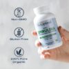 Tabletas espirulina BioOptimal en mano
